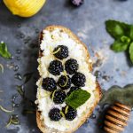 Ricotta crostini top with blackberry and honey